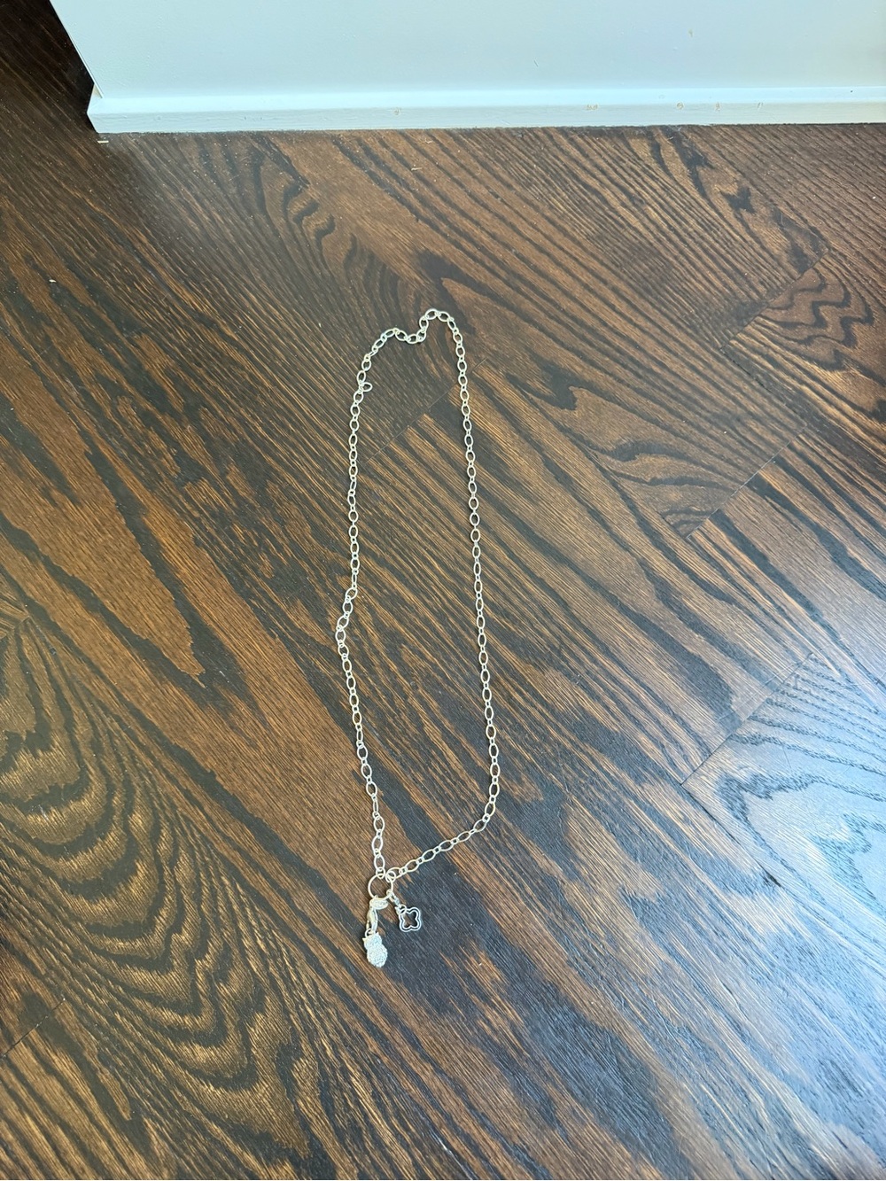 Silver-tone oval link chain necklace with two hanging charms